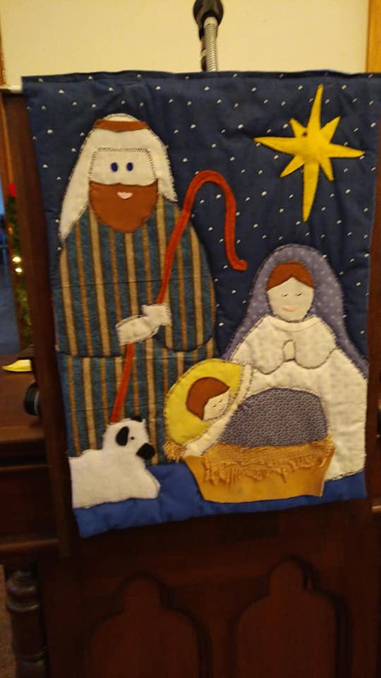 Interior of Kingdom Hall during a congregation meeting